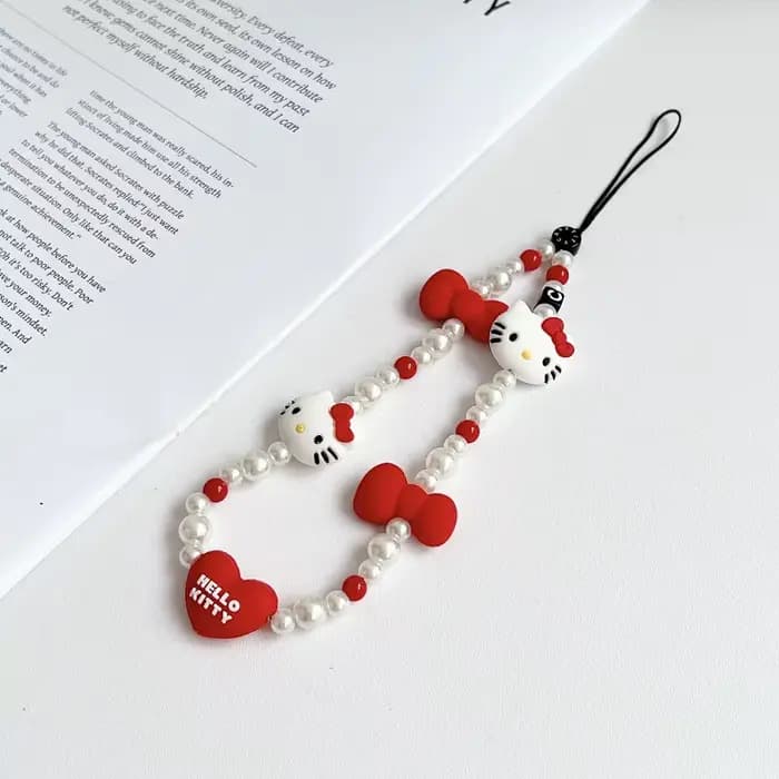 Cordon de téléphone Kawaii Hello Kitty avec nœud et perles pour appareil photo, accessoire de téléph